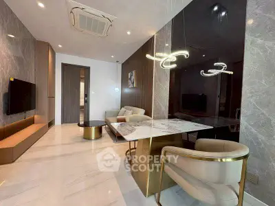 Luxurious modern living room with elegant marble accents and stylish lighting