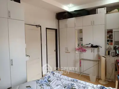 Spacious bedroom with ample storage and modern decor