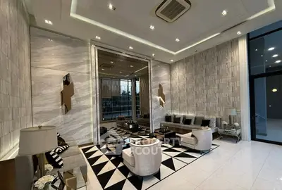 Luxurious modern living room with elegant decor and high ceilings