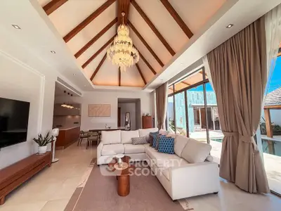 Luxurious living room with vaulted ceiling and elegant chandelier in a modern home.