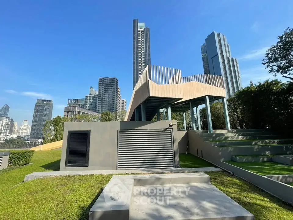 Modern urban rooftop with stunning city skyline view and lush greenery.