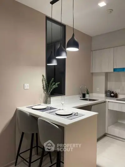 Modern kitchen with sleek design and stylish pendant lighting