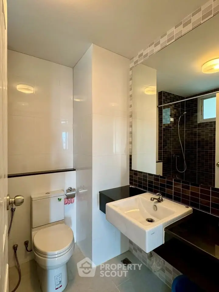 Modern bathroom with sleek fixtures and stylish tile design