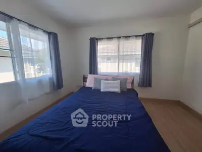 Cozy bedroom with natural light and stylish decor in modern home