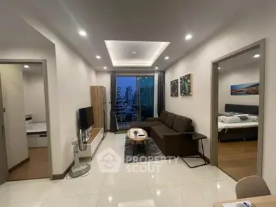 Modern living room with city view, stylish decor, and cozy ambiance