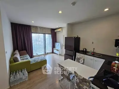 Modern living room with open kitchen and balcony view