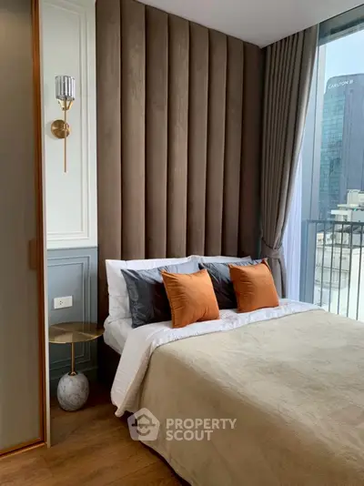 Luxurious bedroom with modern design and city view, featuring plush bedding and elegant decor.