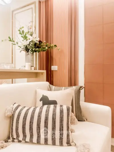 Stylish living room with cozy sofa and decorative pillows, perfect for modern interiors.