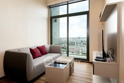 Modern living room with city view and stylish furniture