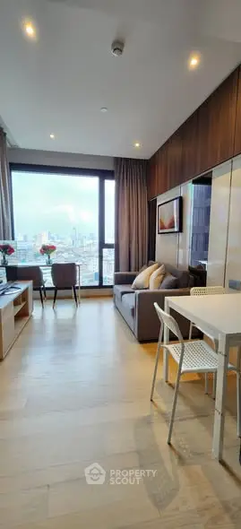 Modern living room with city view, stylish furniture, and elegant decor