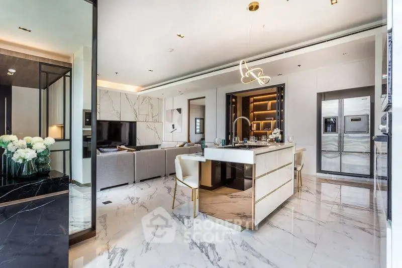 Luxurious open-plan living room with modern kitchen and elegant marble flooring.