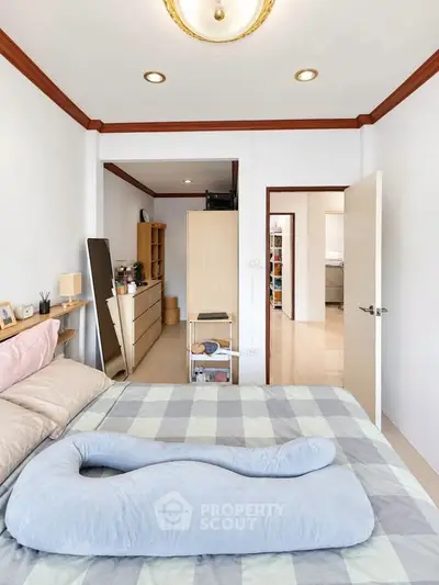 Cozy bedroom with modern decor and ample storage space