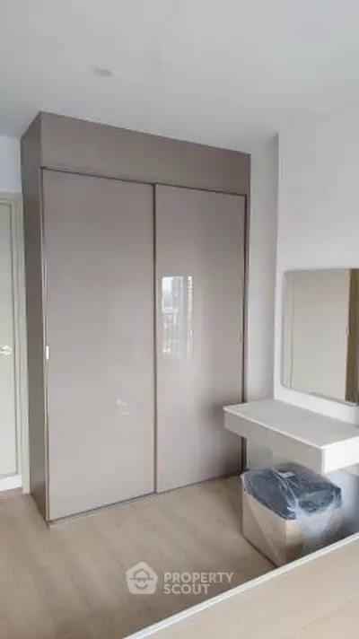 Modern bedroom with sleek wardrobe and minimalist design