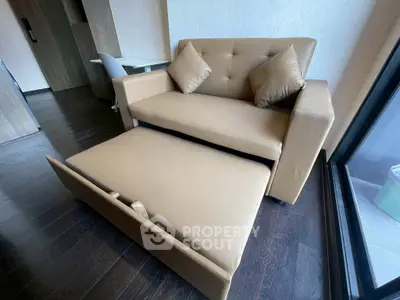 Modern living room with stylish sofa bed and sleek wooden flooring