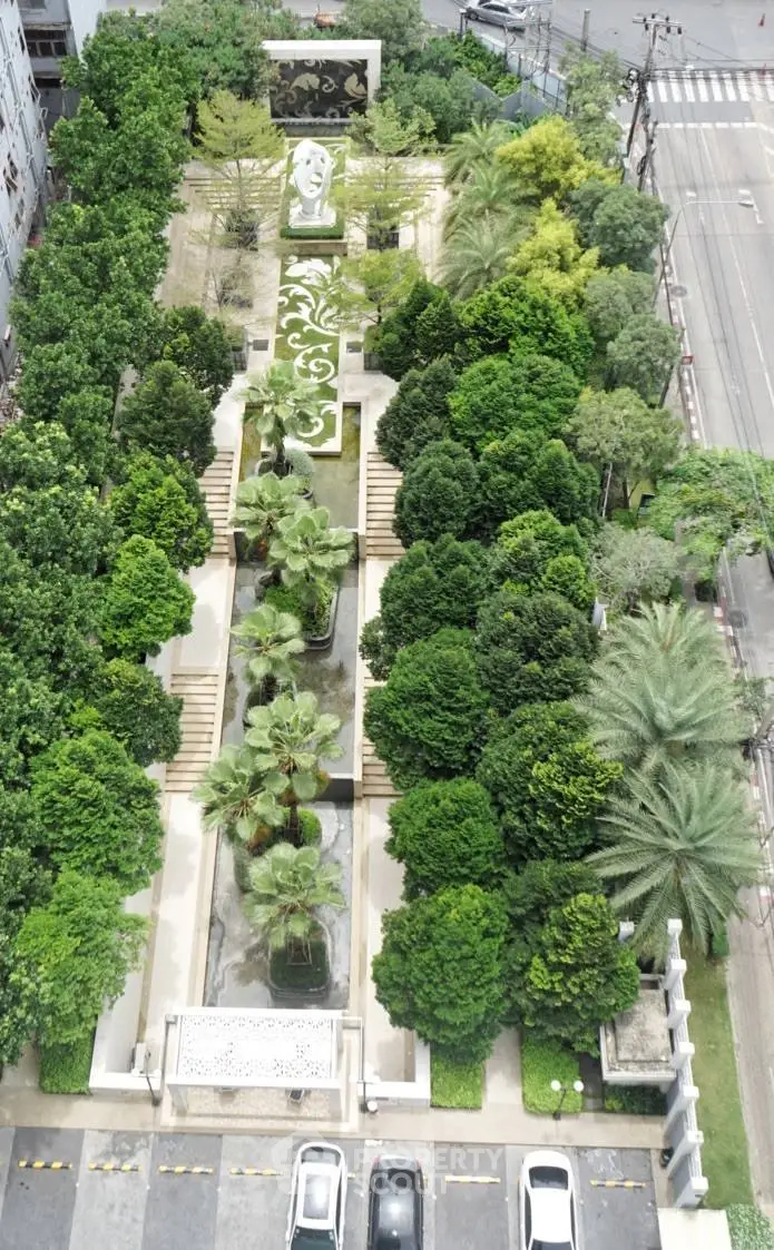 Stunning aerial view of lush garden landscape with artistic design in urban setting, perfect for relaxation and leisure.