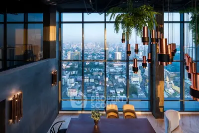 Luxurious high-rise dining area with stunning city view and modern lighting.