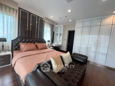 Luxurious bedroom with elegant decor and ample natural light