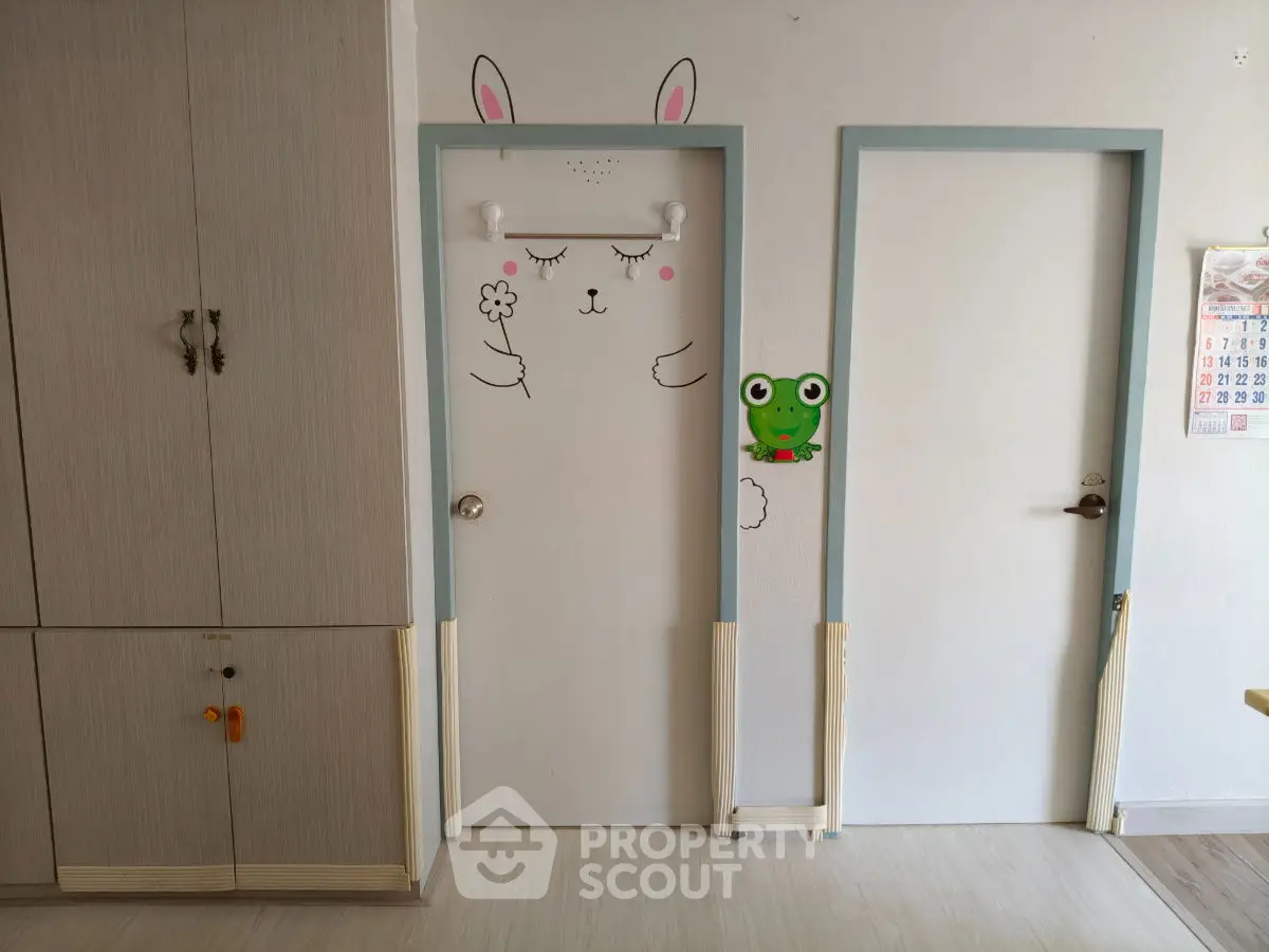Charming interior with playful door art and sleek storage solutions