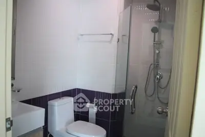 Modern bathroom with glass shower and sleek fixtures