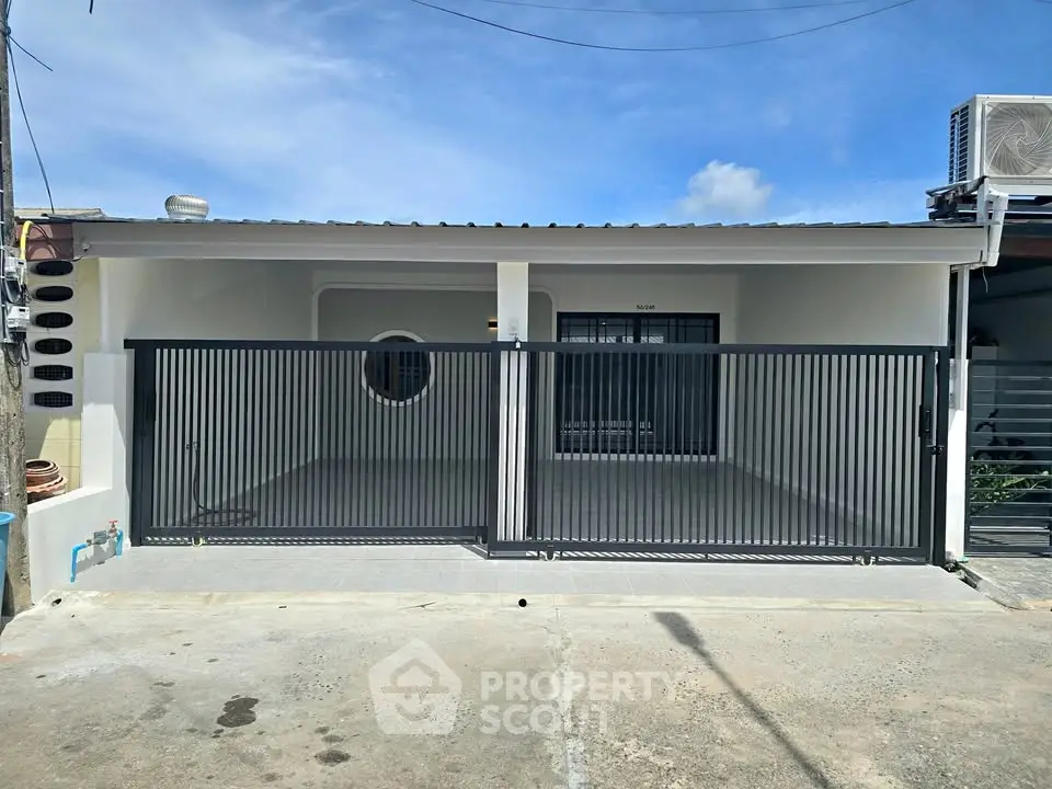 Charming single-story home with gated entrance and modern design.