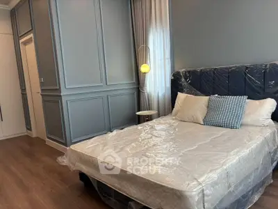 Elegant bedroom with modern paneling and cozy lighting