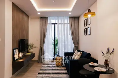 Modern living room with stylish decor and large window for natural light.
