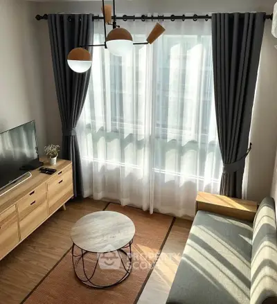 Charming living room with modern decor, large window, and stylish furniture, perfect for cozy relaxation.