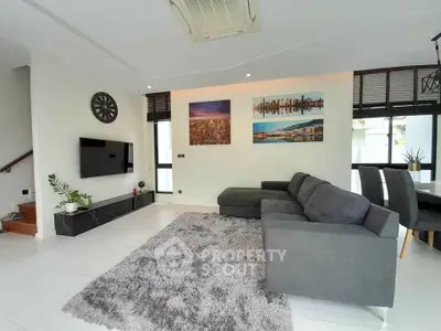 Modern living room with stylish decor and cozy gray sofa