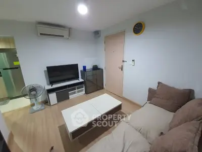 Cozy living room with modern furniture and air conditioning in a stylish apartment.