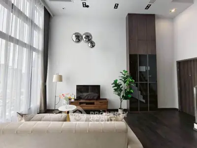 Luxurious modern living room with high ceilings and elegant decor