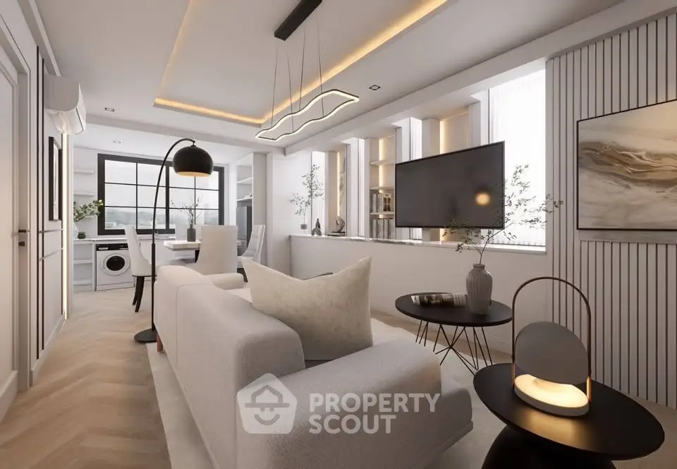 Modern living room with stylish decor and open layout, featuring a cozy seating area and contemporary lighting.