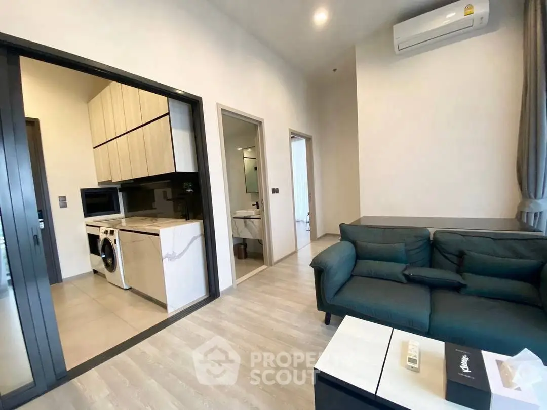 Modern apartment interior with cozy living room and sleek kitchen