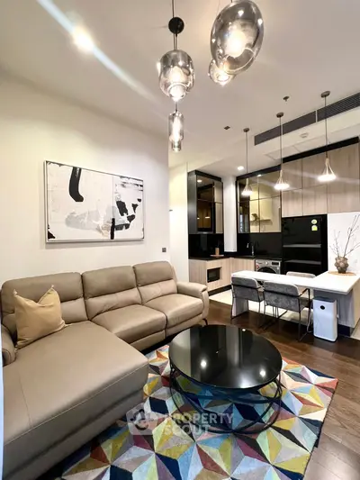 Modern living room with stylish decor and open kitchen layout