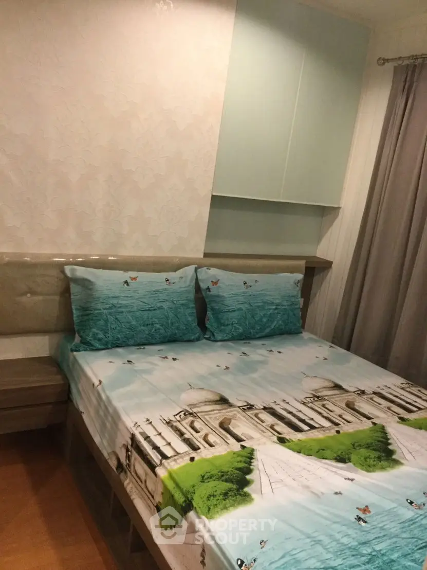 Cozy bedroom with unique Taj Mahal themed bedding and elegant decor.