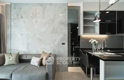 Modern living room with sleek kitchen and stylish decor