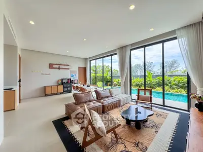 Spacious living room with pool view and modern decor