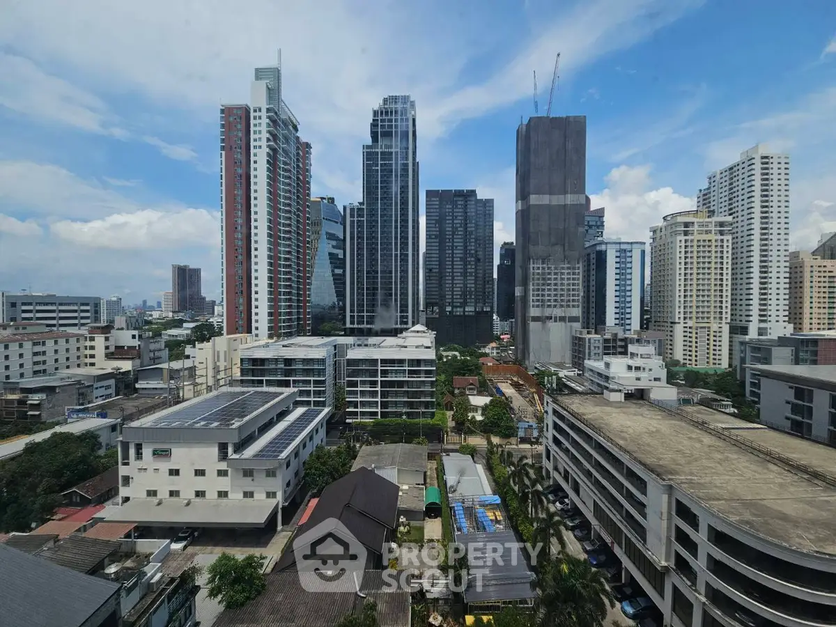 Stunning cityscape view of modern high-rise buildings under a clear blue sky.