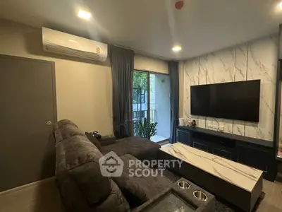 Modern living room with sleek TV setup and cozy sectional sofa