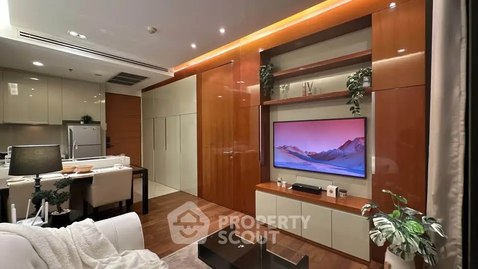 Luxurious modern living room with open kitchen, sleek wooden finishes, and stylish decor