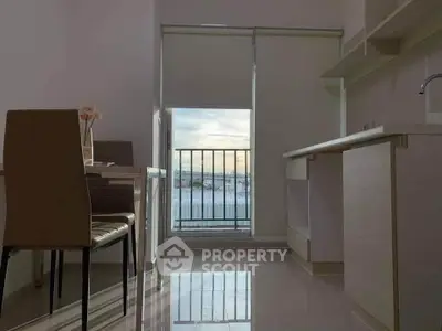 Modern kitchen with sleek design and balcony view, perfect for urban living.