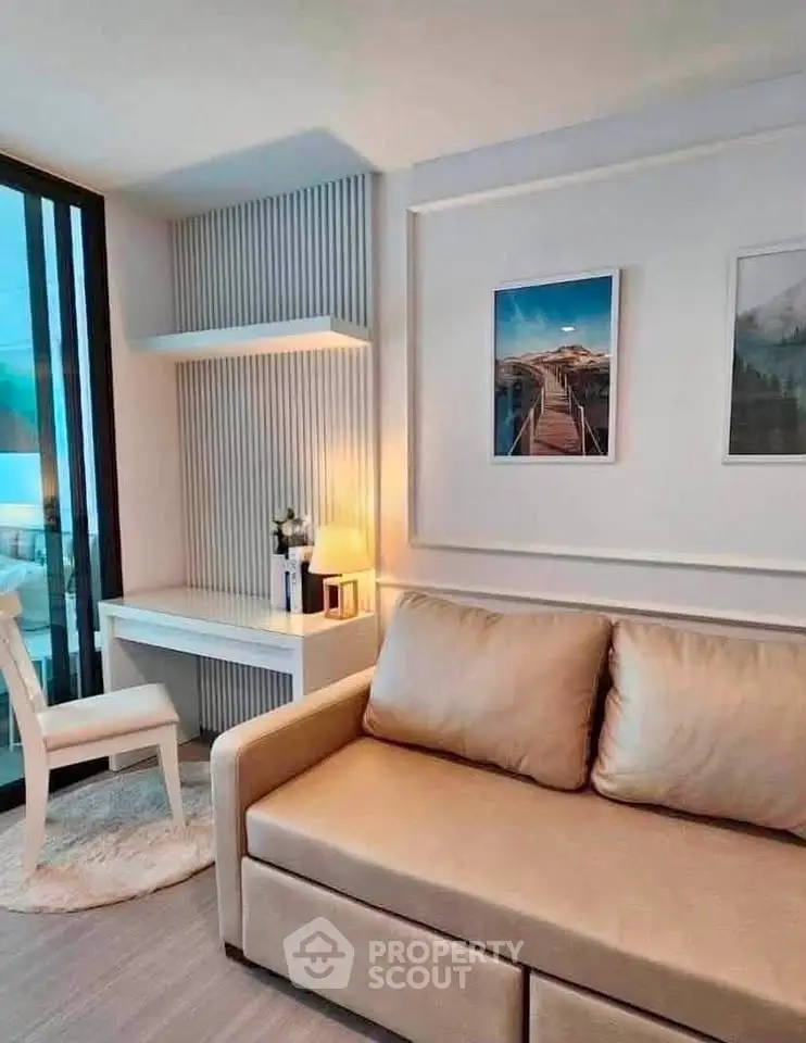 Modern living room with cozy sofa and stylish decor in a contemporary apartment.