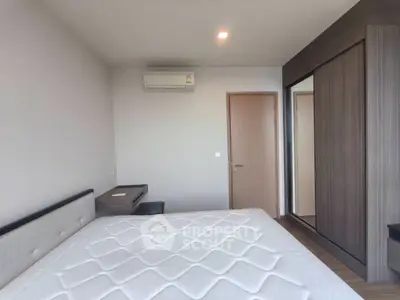 Modern bedroom with air conditioning and built-in wardrobe, perfect for comfort and convenience.