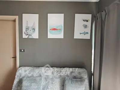 Cozy living room with modern art and plush seating
