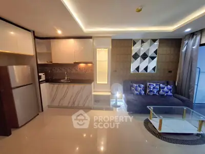 Modern open-layout living room with stylish kitchen and cozy seating area