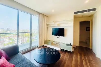 Modern living room with city view, large windows, and stylish furnishings in a high-rise apartment.