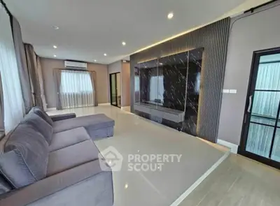 Spacious modern living room with elegant decor and large windows