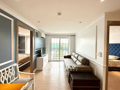Bright living room with modern decor and balcony view
