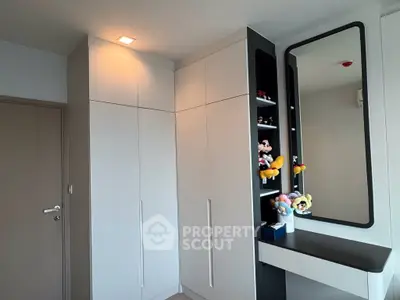 Modern bedroom with sleek built-in wardrobe and stylish mirror
