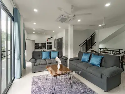 Spacious modern living room with stylish furniture and open layout