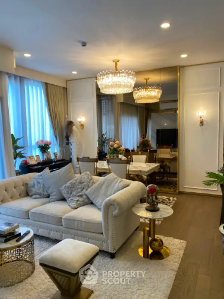 Luxurious living room with elegant decor and plush seating in a modern apartment.